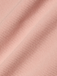 Close-up of light pink, high-stretch rib fabric with diagonal textured lines that form a raised and flat pattern across the material—an ideal choice for the Nica Scoopneck Bodysuit.