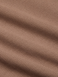 Close-up of the Adira Scoopneck Tank in brown, featuring stretch rib fabric with diagonal textured lines and soft shadows that highlight the material’s weave and surface detail.