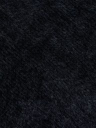 Close-up of the ultra-soft knit fabric of the Guinevere Cropped Pullover in black, highlighting the plush surface, fine fiber details, and subtle directional variations.