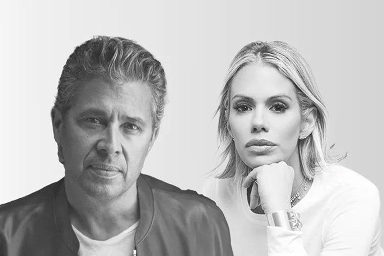 A grayscale photo of a man and a woman posing side by side. The man has short, wavy hair and wears a jacket over a t-shirt. The woman has shoulder-length hair and rests her chin on her hand, wearing a long-sleeved top.
