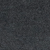 Close-up of a dark, textured surface that appears to be black or dark gray stone or asphalt, with a slightly rough and grainy appearance.