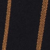A close-up view of a dark fabric with two vertical, parallel brown or tan stripes. The texture of the material is visible, suggesting it might be clothing or upholstery.