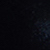 A mostly dark image with a faint patch of light blue and gray hues on the right side, fading into black on the left.