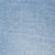 A close-up of light blue denim fabric, showing its textured weave and subtle color variations.