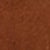 Close-up of a textured brown surface, possibly leather or suede, with a slightly uneven color and visible grain pattern.