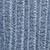 Close-up view of blue ribbed knit fabric, showing a vertical textured pattern and soft material, commonly used in sweaters or scarves.