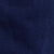 Vue rapprochée dun tissu ou dune surface bleu foncé, légèrement texturé, avec de subtiles variations dombres.