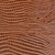 Close-up of a brown wooden surface showing natural grain patterns and texture.