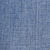 Close-up of a textured blue fabric with a visible woven pattern, showing intersecting threads forming a subtle grid design. The material appears soft and slightly uneven in color.
