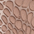 Close-up of a textured pattern resembling reptile or snake skin, with irregular, rounded shapes in shades of brown and tan.