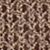 Close-up of a brown fabric with a textured, intricate knitted or woven pattern featuring interlocking, looping designs.