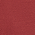 A close-up of a textured red surface, possibly fabric or paper, with a subtle pattern and slight variations in color and texture throughout.