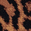 Close-up of a fabric with a leopard print pattern featuring irregular black spots on a brown and tan background.