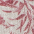 Red botanical or leafy pattern printed on a textured white fabric background.