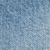 Close-up of a textured blue surface, resembling soft fabric or a sponge, with a pattern of small, rounded bumps evenly spread across the image.