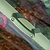 Close-up of the Pacific PC Cloche carry handle secured to the olive green frame| Vego Garden