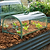 Close-up of a Pacific PC Cloche covering leafy vegetables in a metal raised garden bed| Vego Garden