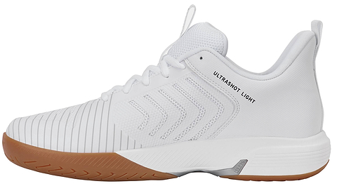 The K-Swiss Ultrashot Light Indoor Men's Badminton Shoes in White/Black/Silver feature a white mesh upper, textured side stripes, and a light brown non-marking gum rubber outsole. The "ULTRASHOT LIGHT" text appears near the heel, making these shoes from K-Swiss an ideal choice for indoor badminton play.