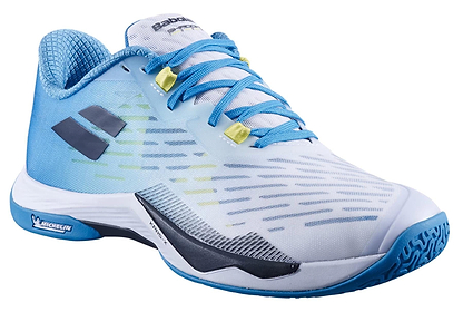 The Babolat Shadow Tour 5 Men's Badminton Shoes in Algier Blue feature a light blue and white design with blue laces, yellow lace eyelets, a patterned blue sole, black logo, and Michelin branding near the sole.