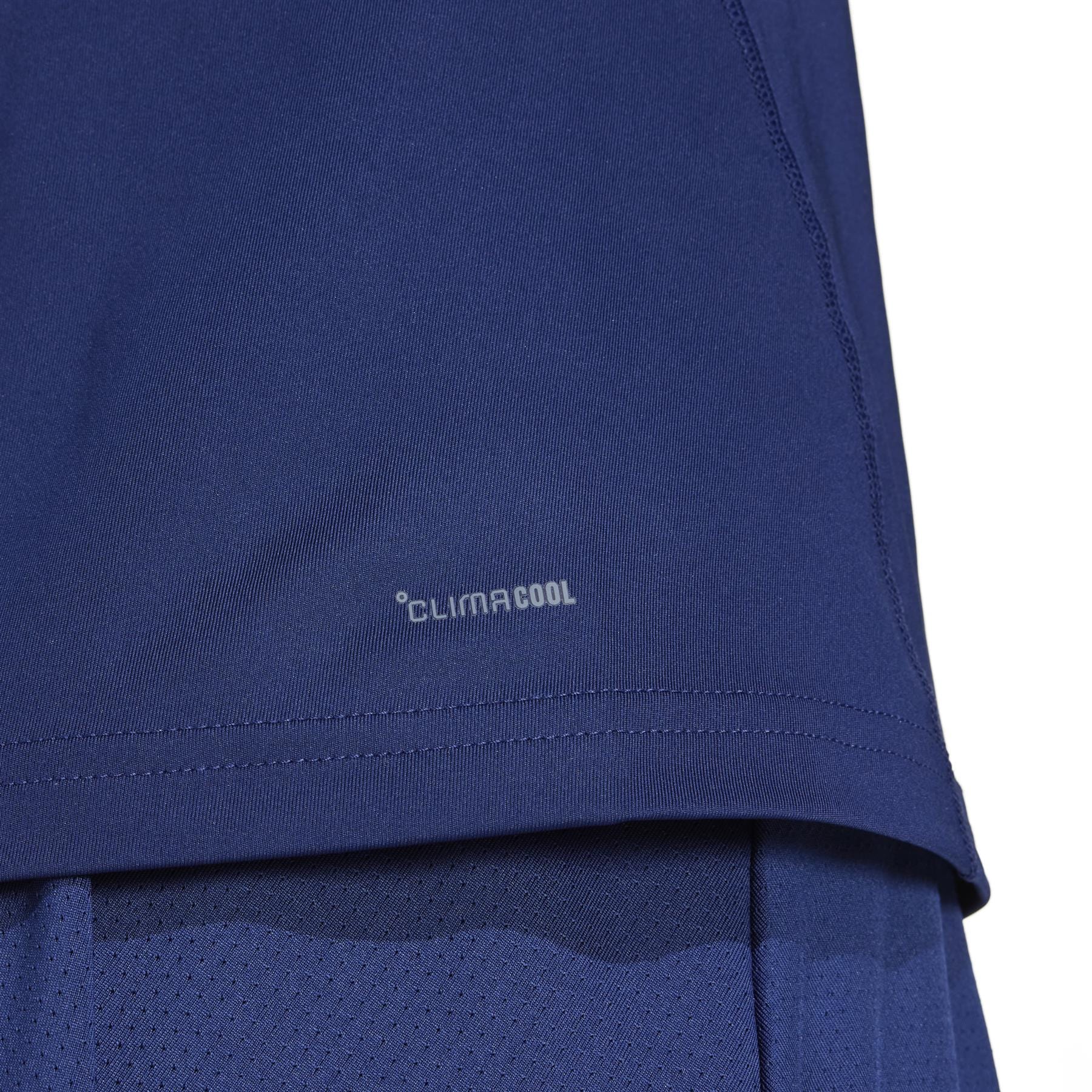 Close-up of an adidas Women's Club Badminton Tank Top in navy, highlighting "Climacool." It's lightweight, breathable, and crafted from recycled materials for a sustainable activewear option.