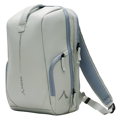 The Kanso Intuko Badminton 23L Backpack in grey is sleek and minimalist, featuring the Kanso logo, handles, multiple zippered compartments, and adjustable shoulder straps with mesh padding.