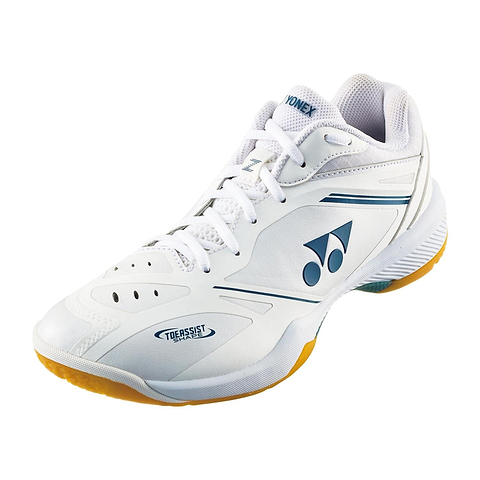 The Yonex Power Cushion 65Z4 Men's Badminton Shoes in white feature blue accents, a lace-up front, and yellow soles—ideal for advanced indoor players.