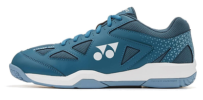The Yonex Power Cushion Strider Ray Unisex Badminton Shoes in teal blue feature white accents, a thick shock-absorbing sole in white and light blue, mesh and synthetic overlays, and "Power Cushion" text on the side.