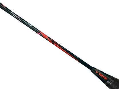Close-up of a Victor badminton racket, specifically the Victor Thruster Ryuga Metallic C 3U, showcasing its shaft with a vibrant design in black and red accents. Made from metallic carbon fibre, the Victor Thruster Ryuga logo is prominently displayed near the handle against a plain white background.