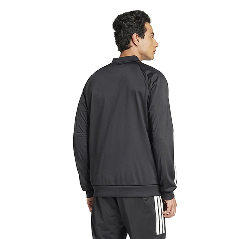 A person is seen wearing the ADIDAS Men's 3 Stripe Knit Badminton Jacket in black, paired with matching pants. They stand facing away on a plain white background.