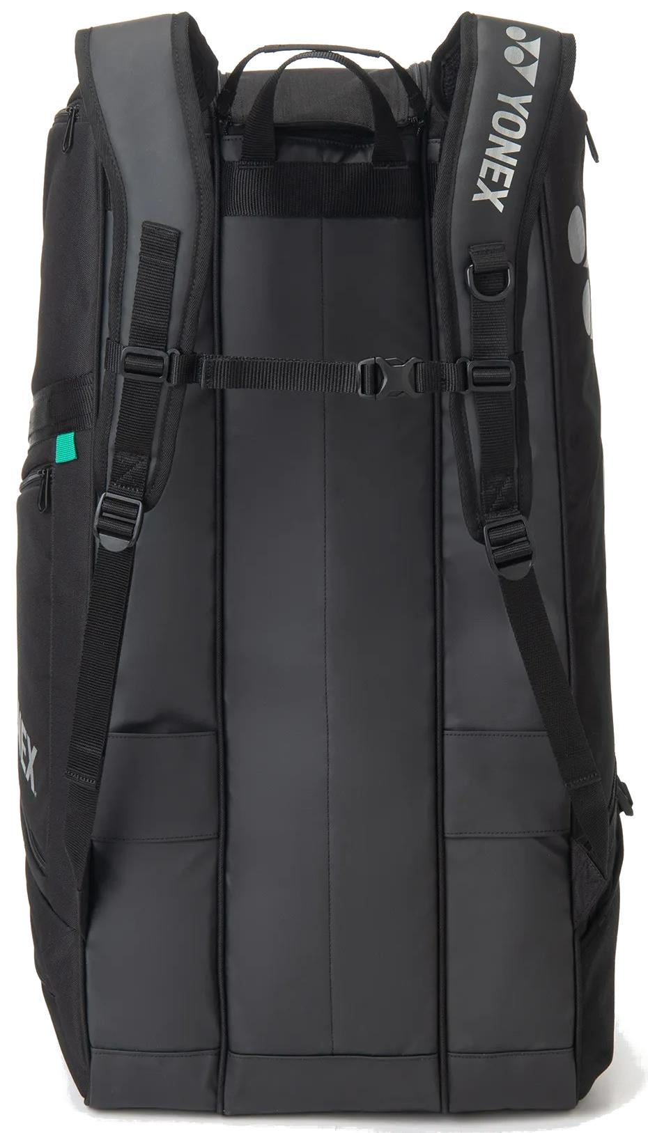 The Yonex BA72629EX Gearlogic 9 Racket Badminton Bag in black stands upright with padded shoulder straps, side pockets, and a white Yonex logo—perfect for carrying your gear to matches or training.