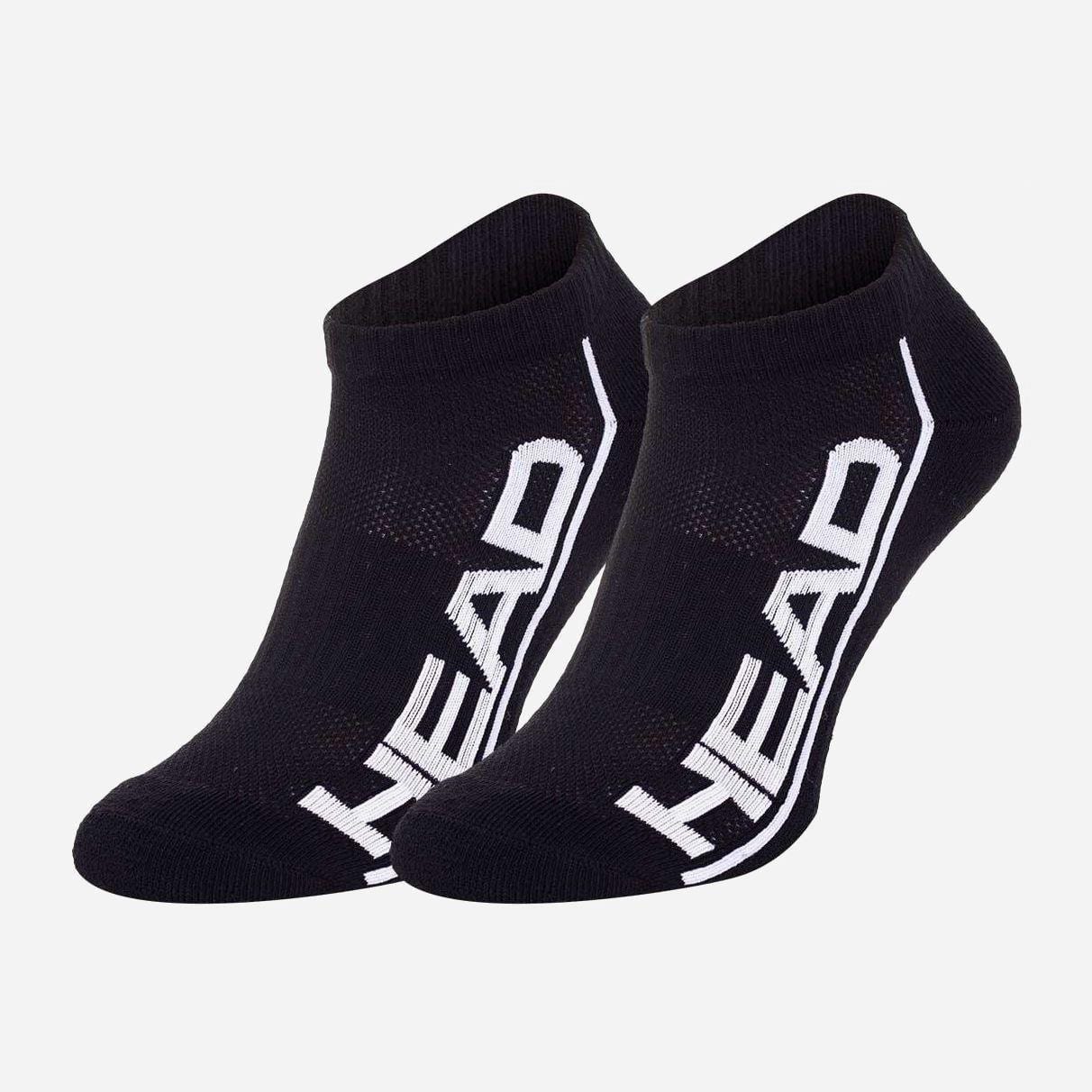 A pair of black HEAD Performance Sneaker Socks from the 2-pack set features "HEAD" in bold white letters along the sides. These socks provide shock absorption and a reinforced arch, blending a minimalist design with functionality, all displayed against a plain white background.