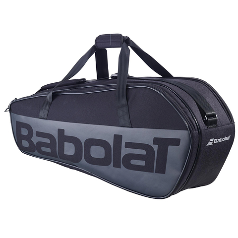 The Babolat Court M 6 Racket Badminton Bag - Black, branded boldly with "Babolat," serves also as a tennis bag. It includes a racquet holder for convenience and offers both a handle and strap for easy transport.