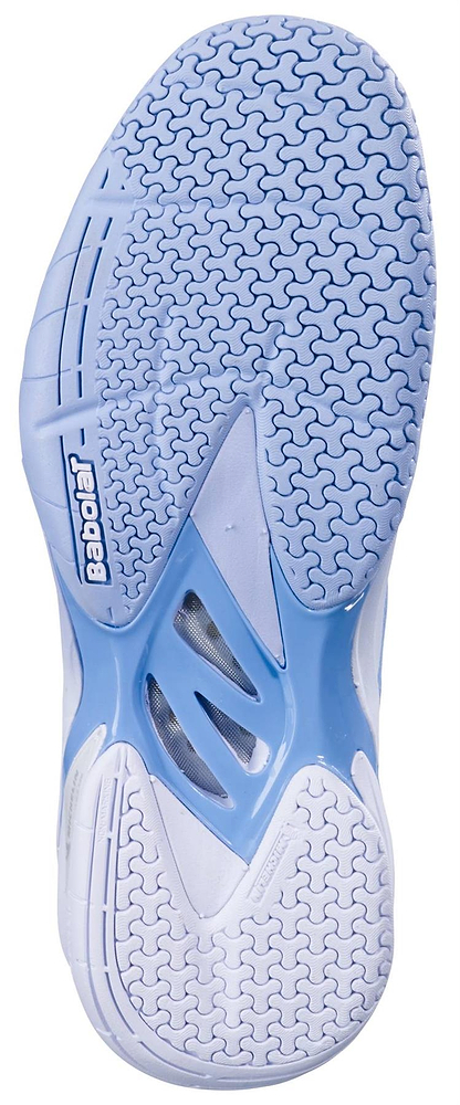 The image displays the light blue and white sole of the Babolat Shadow 4 Womens Badminton Shoes - Snow Blue, featuring a textured zigzag pattern for traction with “Babolat” embossed near the heel.