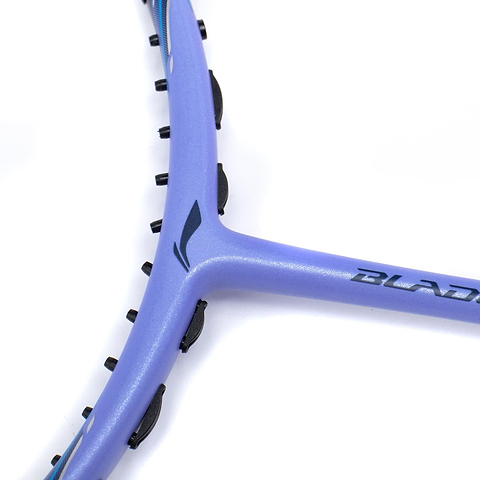 A close-up of the blue frame of the Li-Ning BladeX 900 Moon Max 4U Badminton Racket on a white background highlights the brand logo and some black grommet holes along the edge. The racket incorporates a shock-absorbing system to enhance playability, similar to advanced badminton rackets.