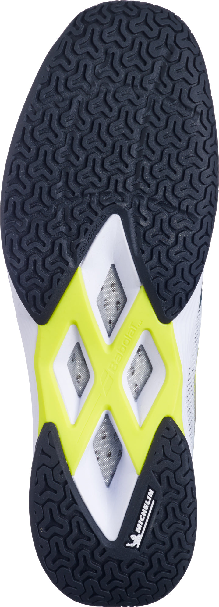 The image shows the black rubber Michelin outsole of the Babolat Shadow Spirit 2 Men's Badminton Shoe (White/Lime), featuring white and lime accents with a Michelin logo near the heel. The tread displays geometric patterns for grip, ensuring excellent traction on court.