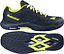 Two views of the Babolat Shadow Team 2 Men's Badminton Shoes by Babolat: a side view features a sleek black and lime color scheme, while the sole view highlights a textured black and lime tread with Michelin outsole branding. Designed for exceptional grip and durability, these shoes are ideal for indoor courts or use as badminton shoes, ensuring top performance in every match.