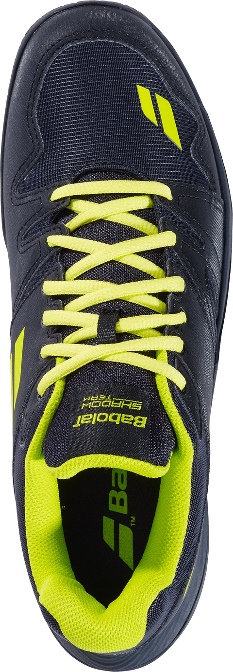 The Babolat Shadow Team 2 Men's Badminton Shoes in Black/Lime, shown from above, feature a sleek black design with striking lime laces, interior lining, and logo accents. Engineered by Babolat as premium indoor court footwear and equipped with a durable Michelin outsole for exceptional grip, these shoes are perfect for badminton players who value both style and performance.
