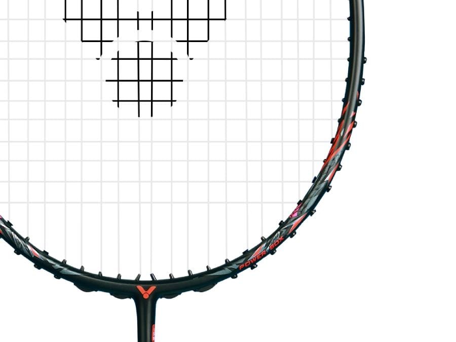 A close-up of the Victor Thruster Ryuga Metallic C 3U badminton racket in black and red highlights its metallic carbon fibre strings and part of the frame against a plain white background.