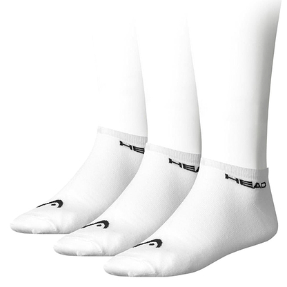 Displayed on white mannequin legs, three pairs of the HEAD Sneaker Badminton Socks in white feature a comfortable cotton blend with a black "HEAD" logo by the ankle and a small logo on the toe.