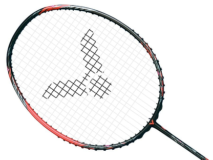 A close-up photo showcases the Victor Thruster Ryuga Metallic C 3U badminton racket in a stylish black and red frame. At the center of the strings, there's a striking logo-like design composed of Metallic Carbon Fibre. The grip is partially visible at the bottom, and it all stands out against a simple white background.