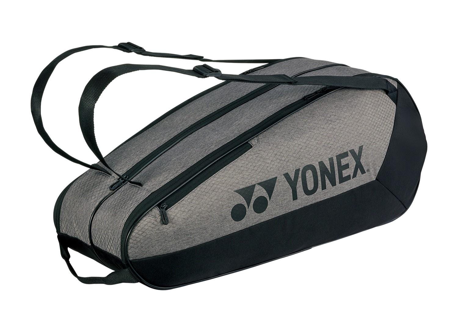 A Yonex 42526EX Team 6 Racket Badminton Bag in grey/black features adjustable straps, two large compartments, and the Yonex logo on the side.