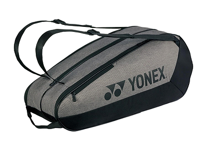 A Yonex 42526EX Team 6 Racket Badminton Bag in grey/black features adjustable straps, two large compartments, and the Yonex logo on the side.