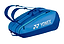 The Yonex 42529EX Team 9 Racket Badminton Bag in Blast Blue features two shoulder straps, a zippered compartment for sports gear, and an aerodynamic design. The Yonex logo is prominently displayed, making it perfect for athletes.