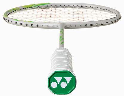A Yonex Astrox 100 Game VA Viktor Axelsen 4U Badminton Racket in greyish beige is shown from the handle end, featuring a green cap with a white logo, white grip, and visible strings and frame.