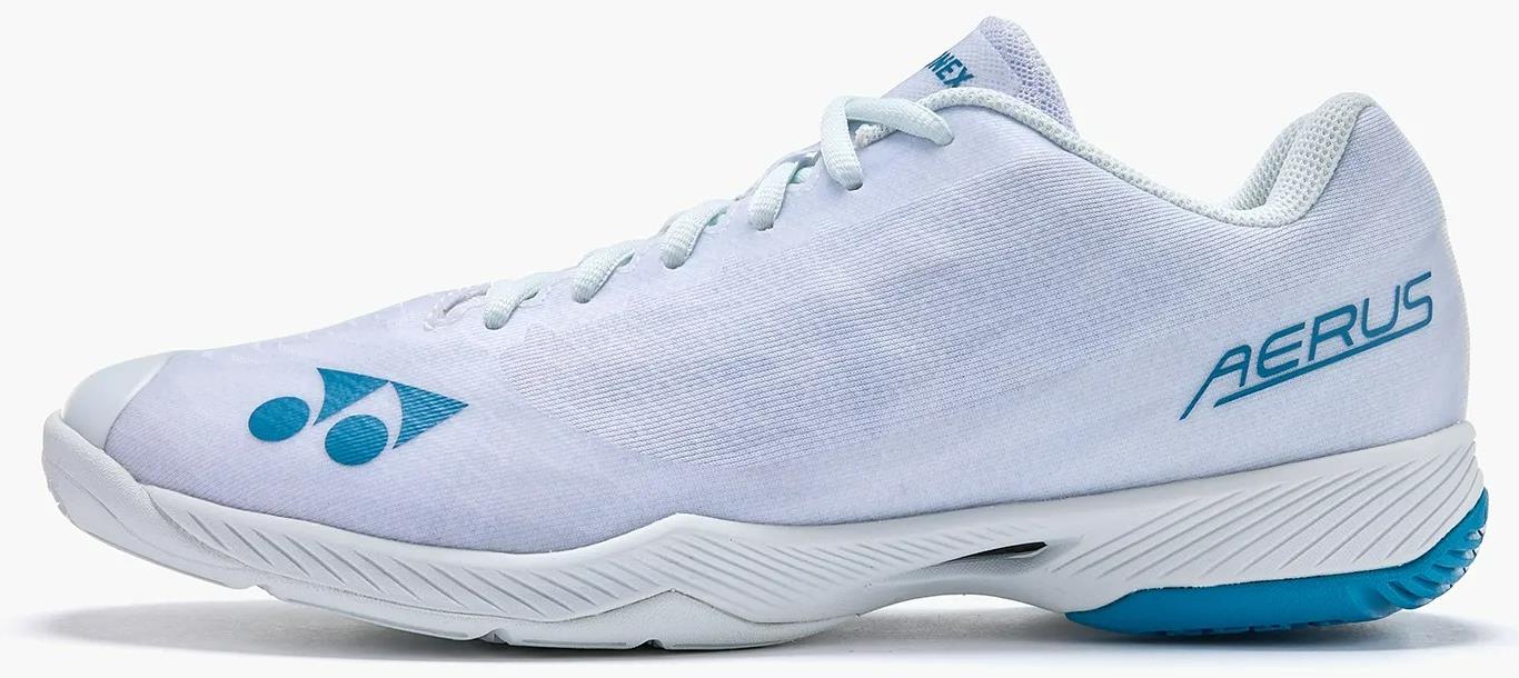 The Yonex Power Cushion Aerus Z2 Men’s Badminton Shoes in white with blue accents, featuring the Yonex logo, "AERUS" text on the side, and advanced Power Cushion technology, are shown from a side profile against a white background.
