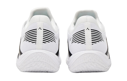 The Kanso Equilibrium EQx3 Unisex Badminton Shoes in white/black feature a rear view with black heel stripes, textured soles, and Speedlight Foam for enhanced shock absorption, ensuring optimal comfort and performance.