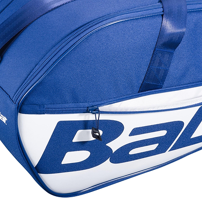 Close-up of the Babolat Court M 6 Racket Badminton Bag in dark blue, featuring a zipper, bold "Ba" lettering, smooth recycled PET fabric for durability, and a reinforced top strap.