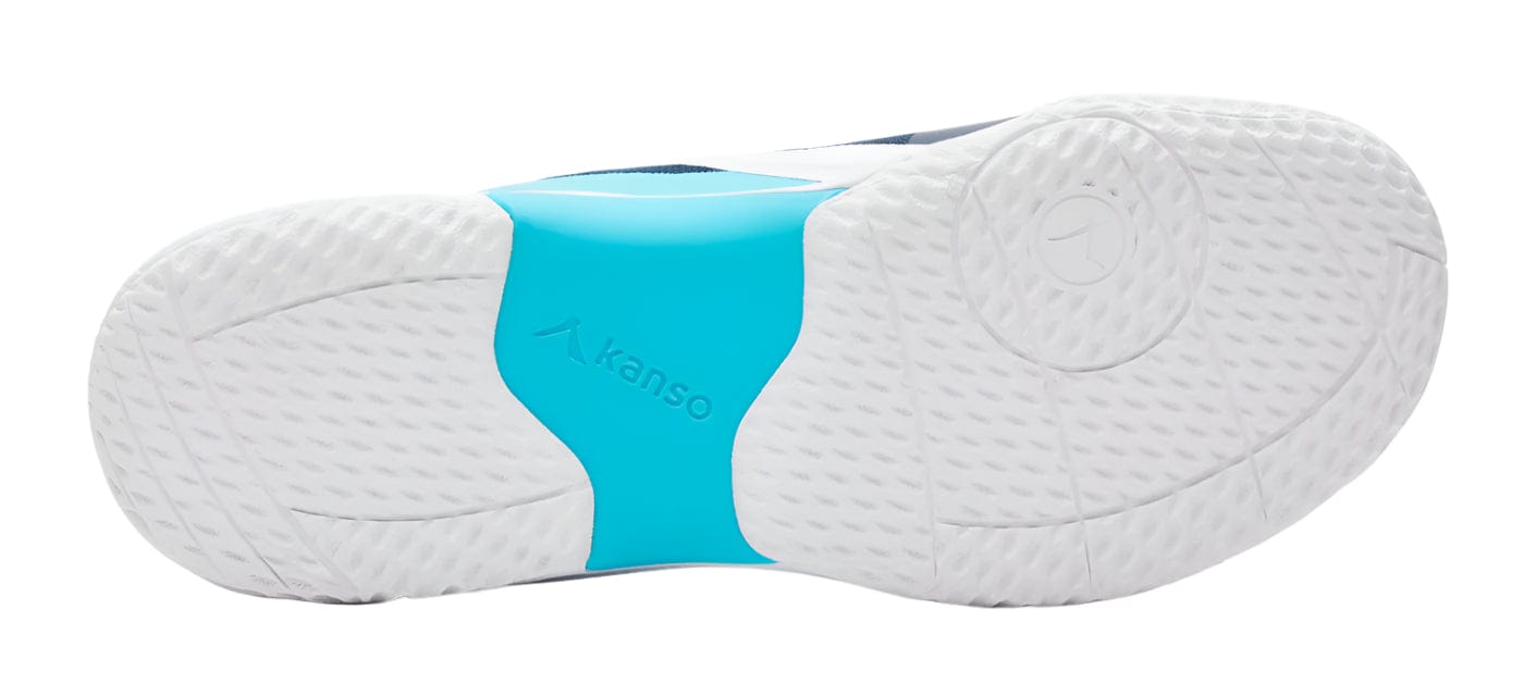 The image showcases the sole of Kanso Equilibrium EQx3 Unisex Badminton Shoes against a white background. The mainly white, textured sole features a blue section with the "Kanso" brand name and logo, symbolizing stability and agility with responsive Speedlight foam.