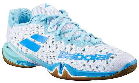 The Babolat Shadow 4 Women’s Badminton Shoes - White Lagoon feature a mesh upper, blue accents, gum rubber sole, and Babolat logo on the side and heel.