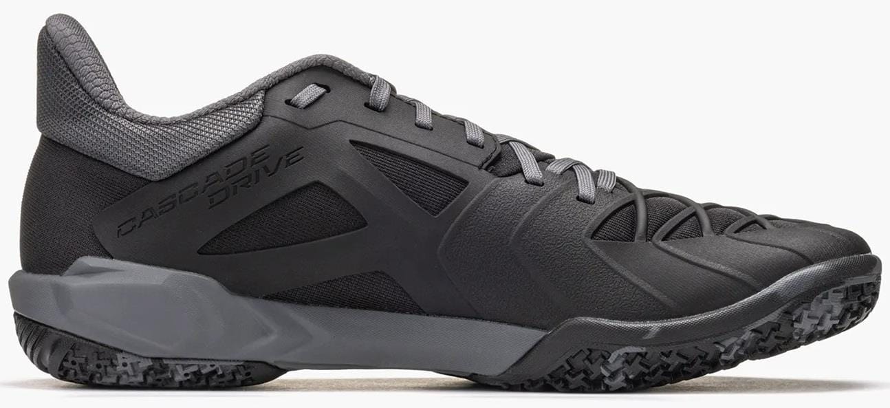 The Yonex Power Cushion Cascade Drive 3 Unisex Badminton Shoe in black/grey features a textured sole, mesh collar, and "Cascade Drive 3" text on the side, shown in a side view against a white background.